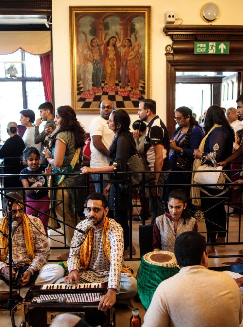 WATFORD, ENGLAND - SEPTEMBER 02: Musicians play as devotees queue to pray during the Janmashtami Festival at Bhaktivedanta Manor on September 2, 2018 in Watford, England. The event is thought to be one of the largest Hindu festival gatherings outside of India.  (Photo by Jack Taylor/Getty Images)