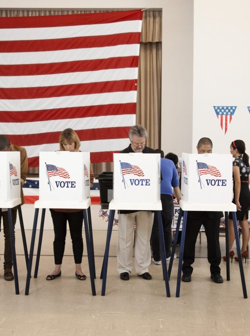 People voting at polling place. (Hill Street Studios/Getty Images)