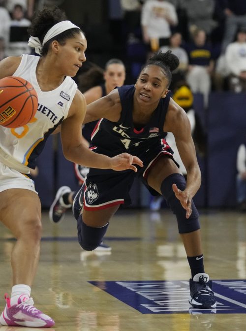 MILWAUKEE, WISCONSIN - FEBRUARY 08: Charia Smith #5 of the Marquette Golden Eagles is fouled by Aubrey Griffin #44 of the UConn Huskies in the second half at Al McGuire Center on February 08, 2023 in Milwaukee, Wisconsin. (Photo by Patrick McDermott/Getty Images)In the 2019-20 academic year, Black students made up less than 6 percent of the population of colleges in the richest and most prominent conferences in college football. However, they made up 48 percent of the student athletes on women’s basketball teams.