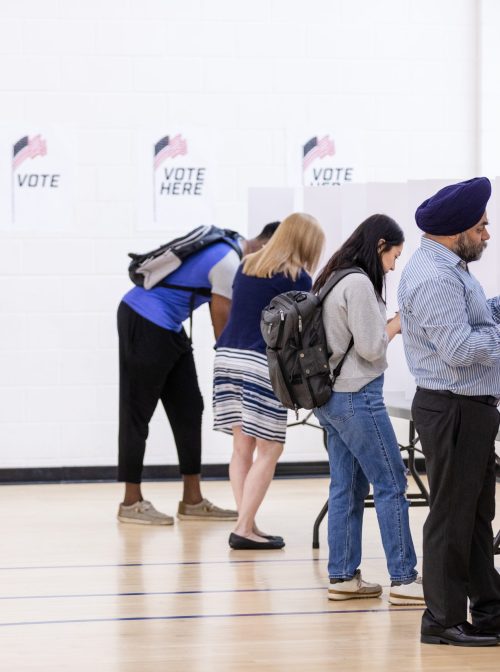 A group of American citizens use ballots to vote in the election. (SDI Productions/Getty Images)