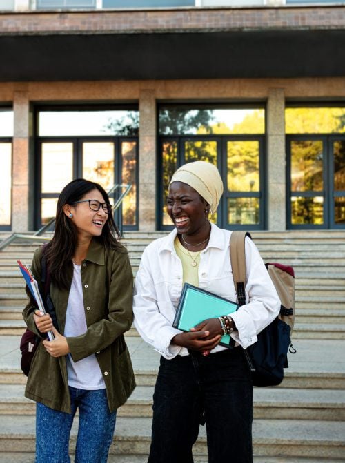 Group of young people on college campus. Daniel de la Hoz/Moment via Getty Images