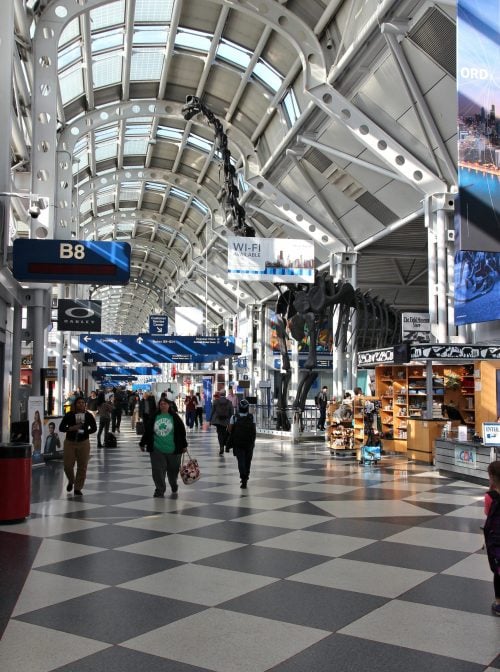 Passengers walk to gate at Chicago O'Hare International Airport in USA. It was the 5th busiest airport in the world with 66,883,271 passengers in 2013.