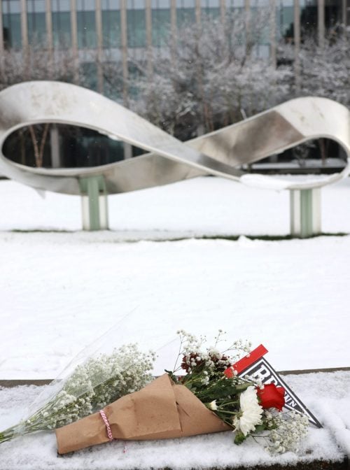 PROVIDENCE, RHODE ISLAND - DECEMBER 14: A bouquet is left outside of the engineering and physics building at Brown University, the site of a mass shooting yesterday that left at least two people dead and nine others injured, on December 14, 2025, in Providence, Rhode Island. A suspect in the shooting was detained overnight at a hotel in a nearby community following a manhunt across the prestigious university and the greater Providence area. The shooting took place around 4 p.m. on Saturday as students were preparing for exams and the holiday break. (Photo by Spencer Platt/Getty Images)