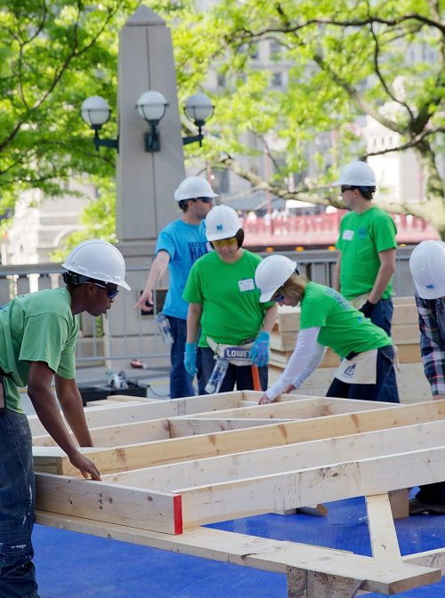 CHICAGO, IL:  Volunteers help kick off Habitat for Humanity's 'Raise Your Hand Chicagoland,' an unprecedented building blitz in the heart of downtown Chicago.  (Photo by Jeff Schear/Getty Images for Habitat For Humanity)