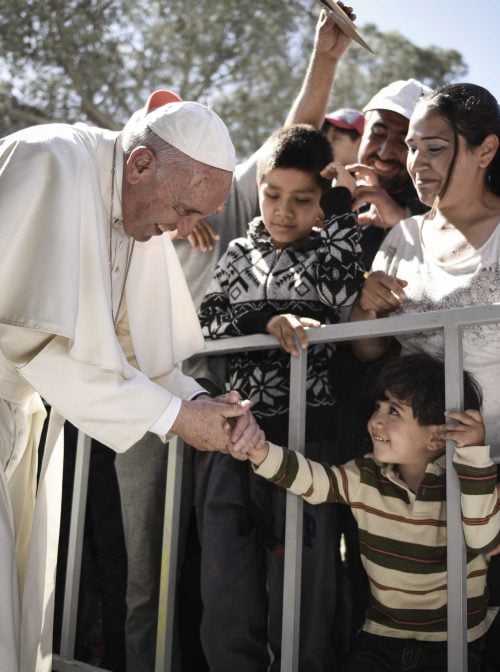 MYTILENE, GREECE - APRIL 16:  In this handout image provided by Greek Prime Minister's Office, Pope Francis meets migrants at the Moria detention centre on April 16, 2016 in Mytilene, Lesbos, Greece. Pope Francis will visit migrants at the Moria camp on the Greek island of Lesbos along with Greek Orthodox Ecumenical Patriarch Bartholomew I and Archbishop of Athens and All Greece, Ieronimos II.  (Photo by Andrea Bonetti/Greek Prime Minister's Office via Getty Images)