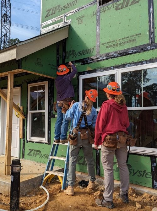 Group of volunteers working on project.