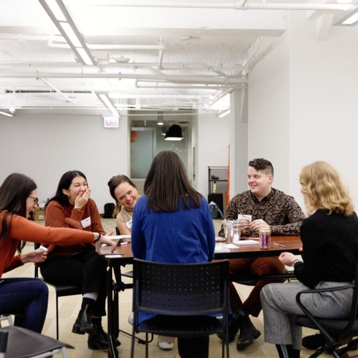 Staff members play team building games after lunch. IA Staff Potluck in Chicago (Nov 2024) Photo by Kelly Feldmiller.