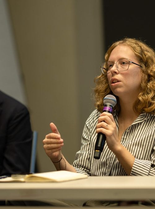 Jax Collins speaks on the "Navigating Faith in the Workplace" panel at the 2025 Interfaith Leadership Summit.