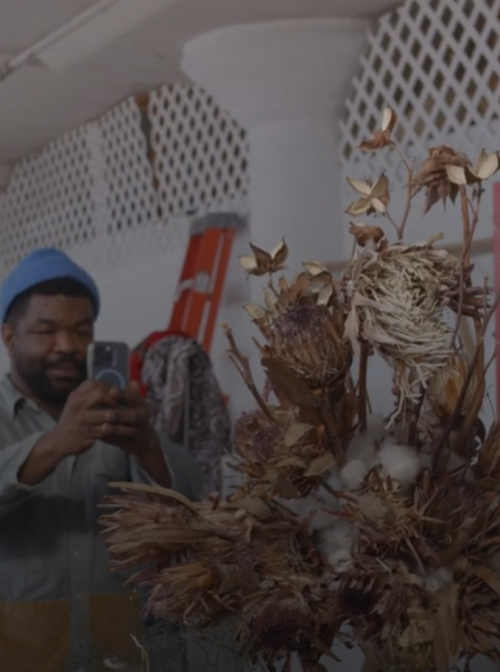 Florist John Pendleton photographs one of his bouquets.