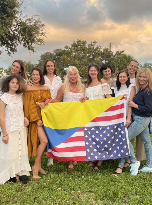 Angie Watstein (back right) with group holding Ukrainian and American flag. Courtesy photo
