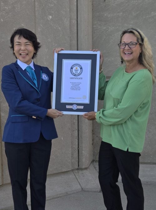 Vicki Garlock poses with a judge from Guinness as she receives her world record certificate. (Photo courtesy of Vicki Garlock)