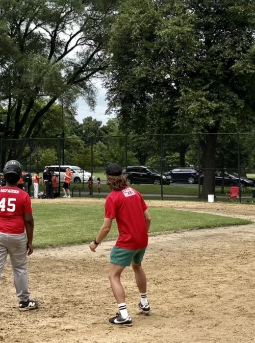 Rollie Olson, center, volunteers as a coach for a teen baseball team, the Garfield Gladiators, on the West Side of Chicago. (Courtesy Photo)