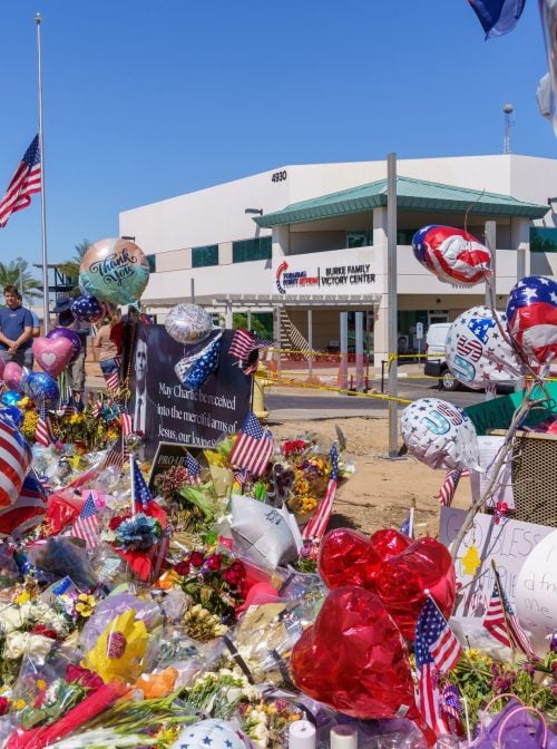 Phoenix, Arizona - September 13, 2025: Memorial and vigil outside the Turning Point USA Headquarters, after Charlie Kirk was killed fatally shot while speaking at Utah Valley University in Orem, Utah. (Shutterstock/melissamn)