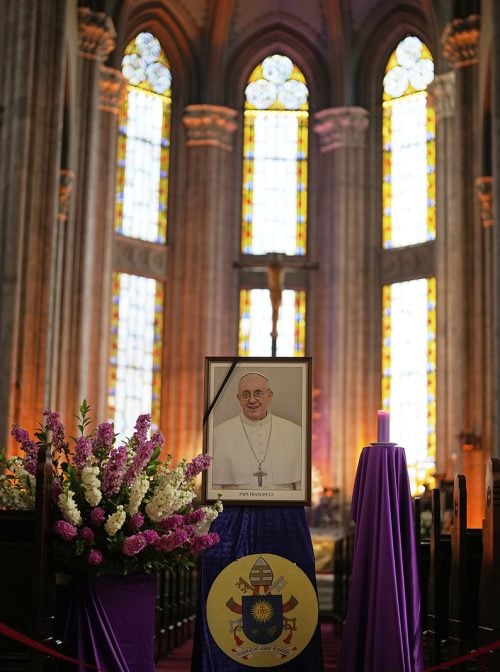 A photograph of the late Pope Francis is placed at Saint Anthony Catholic Church in Istanbul, Turkey, after the announcement of his death, Monday, April 21, 2025. (AP Photo/Khalil Hamra)